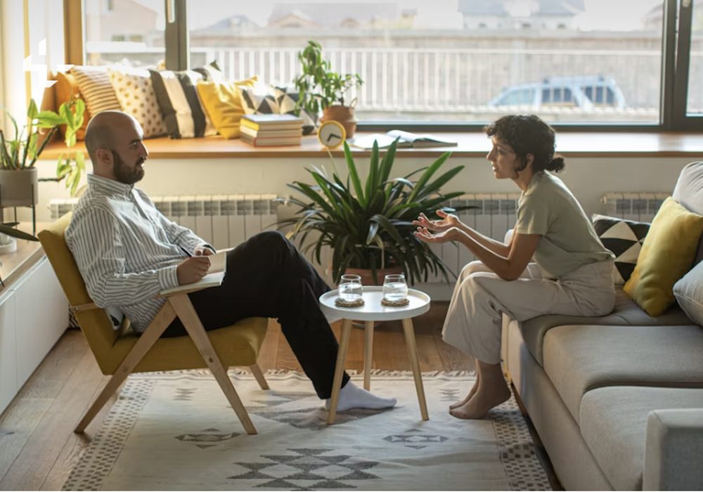 Two people having an unhurried conversation together at home